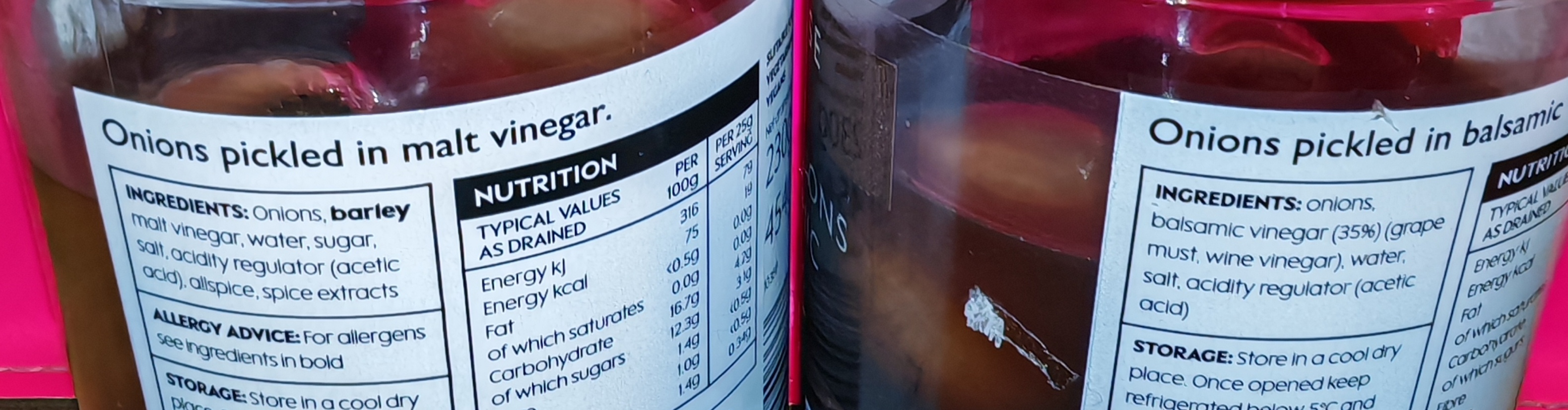 Photo: Close-up of the jar labels showing ingredients lists. The malt vinegar version lists onions, barley malt vinegar, water, sugar, salt, acidity regulator, allspice and spice extracts. The balsamic version shows onions, balsamic vinegar made from grape must and wine vinegar, water, salt, and acidity regulator.